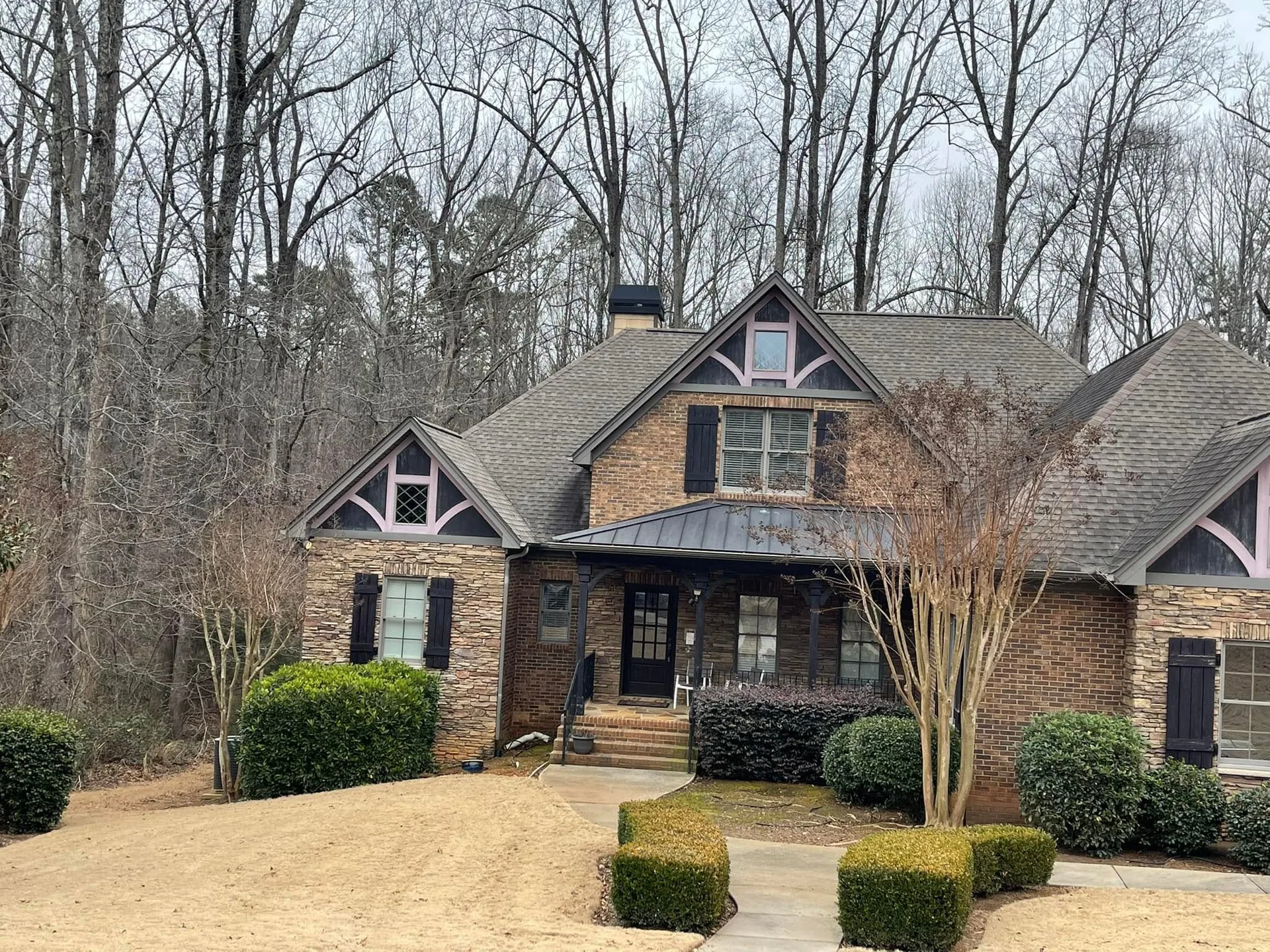 Boxwood hedges front walkway stone brick home winter.2cc090dc