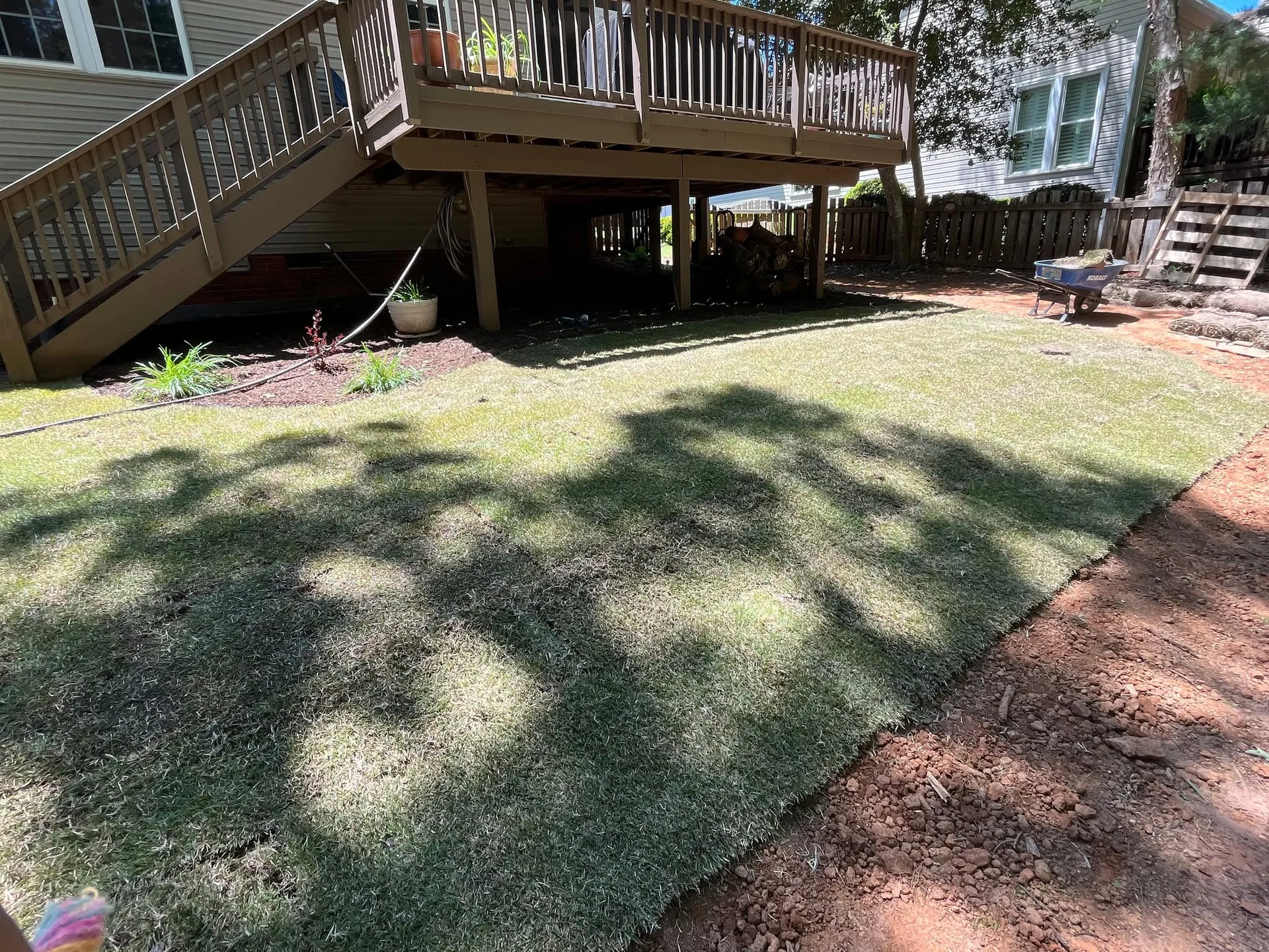 Fresh sod edge red clay elevated deck wheelbarrow.236501e5