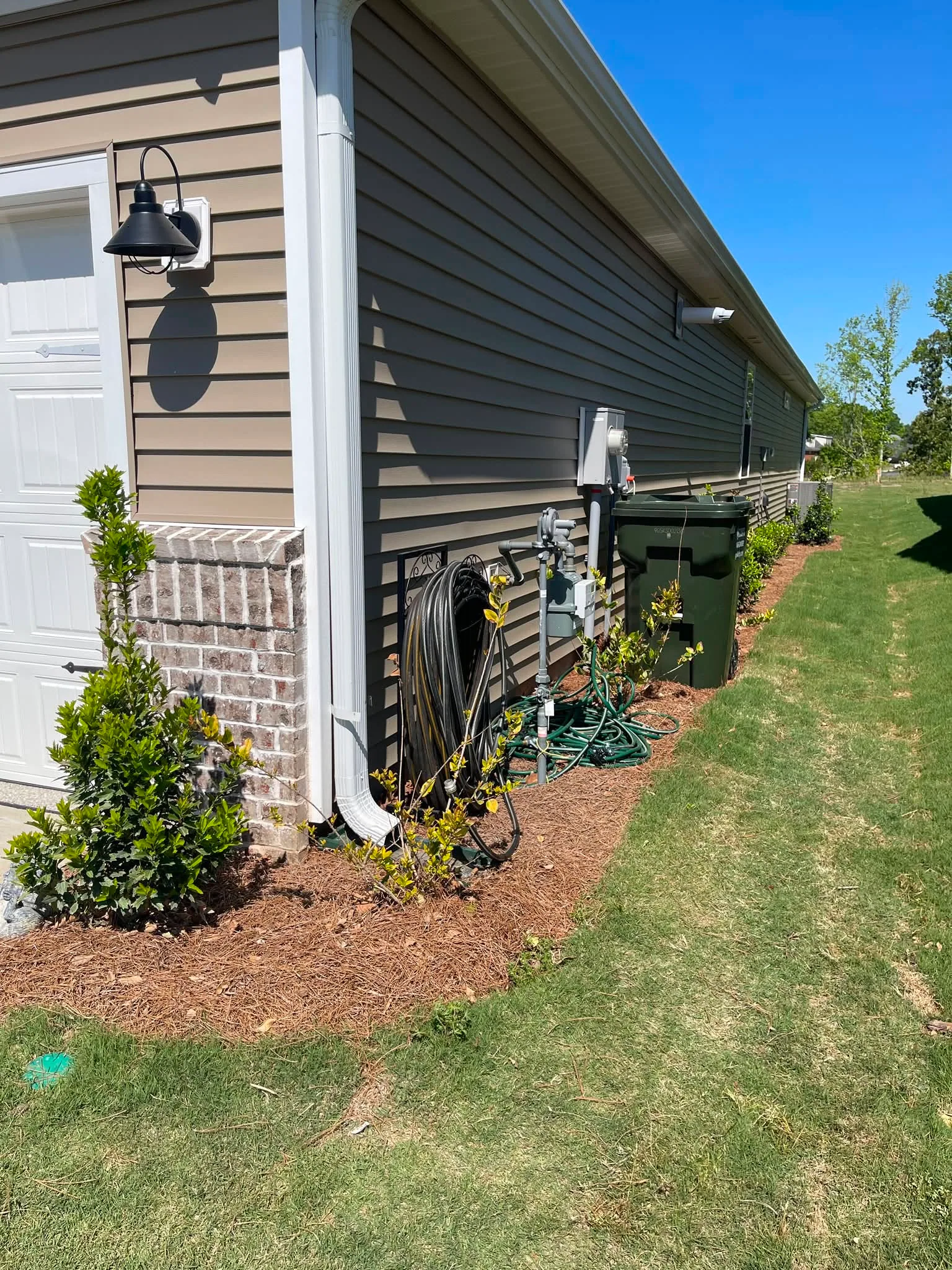 Gas meter side house mulch bed hose reel upstate sc.1f310652