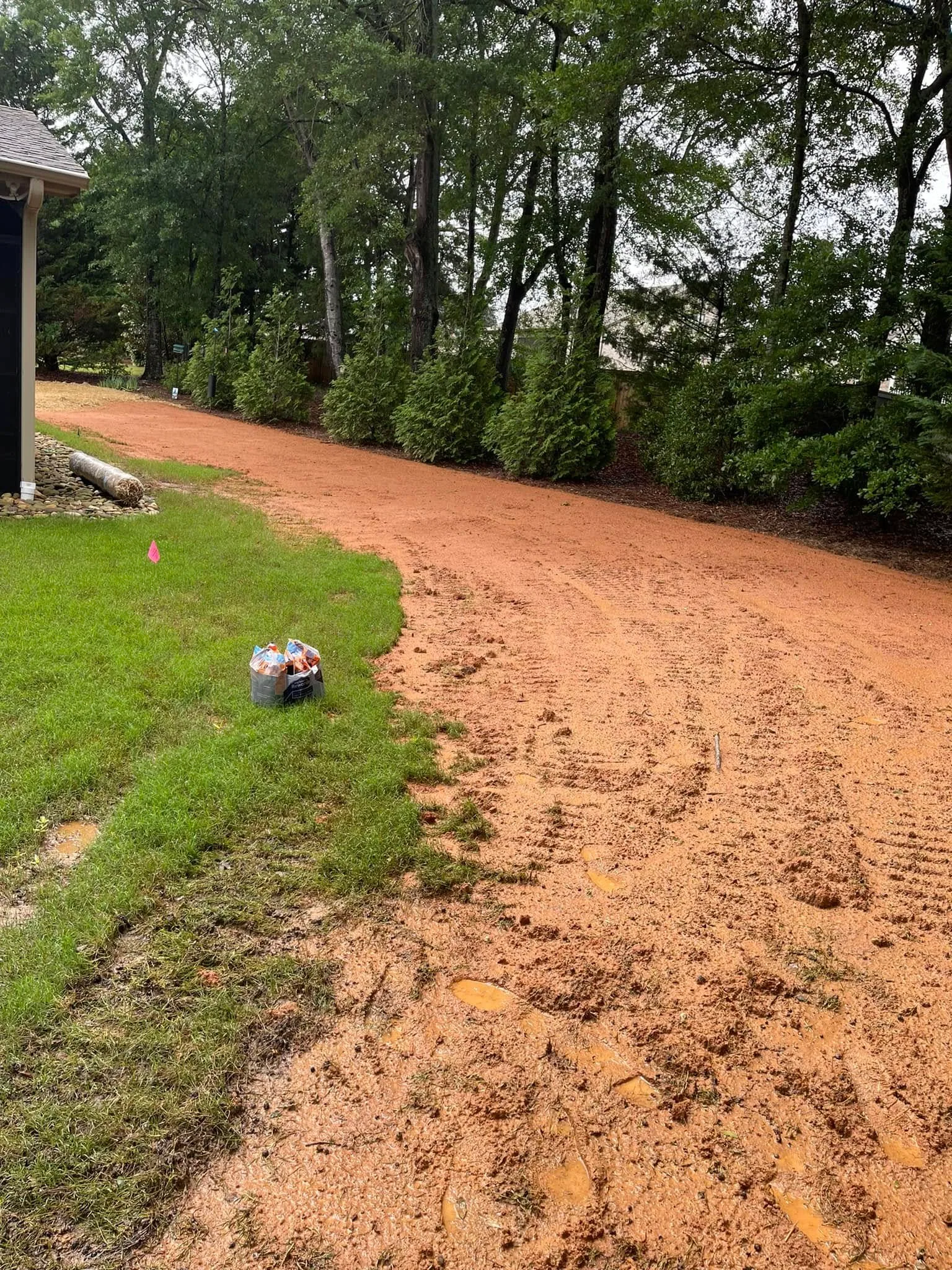 Graded red clay yard sod prep tire tracks.9a7a4c02