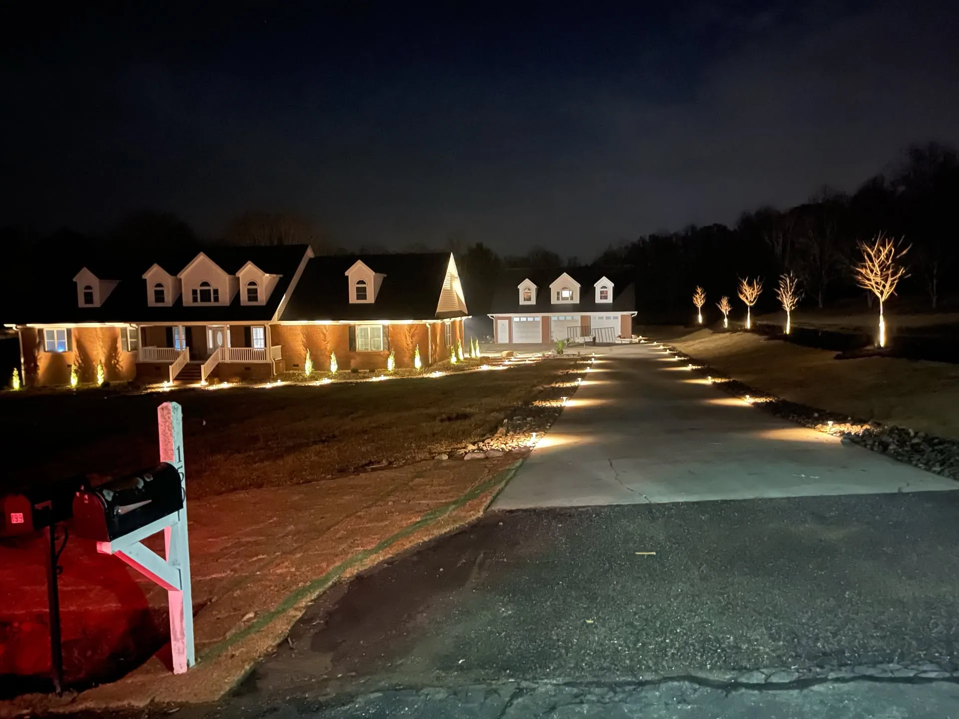 Night driveway path lighting uplit trees upstate SC