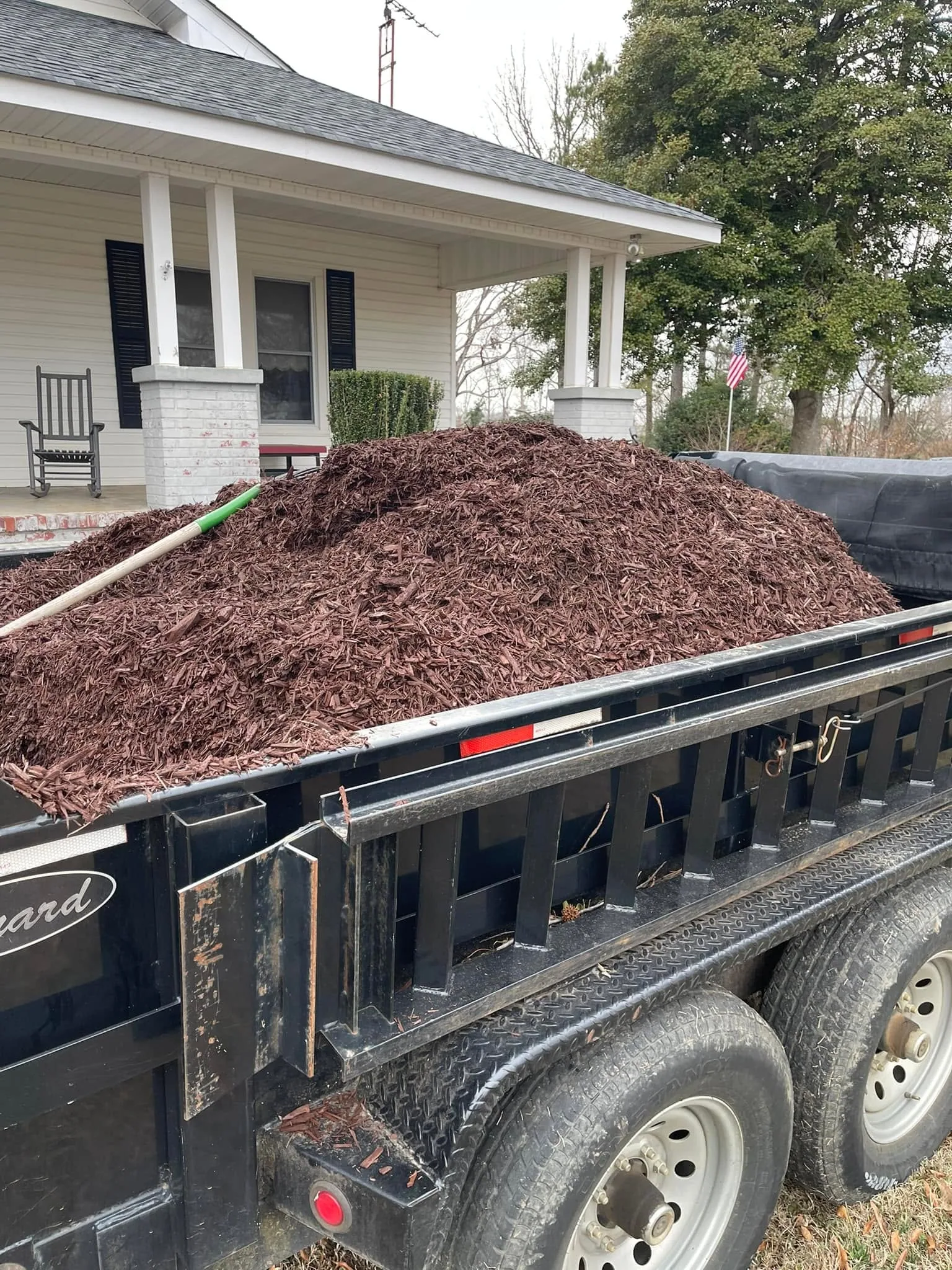 Red mulch load dump trailer farmhouse porch