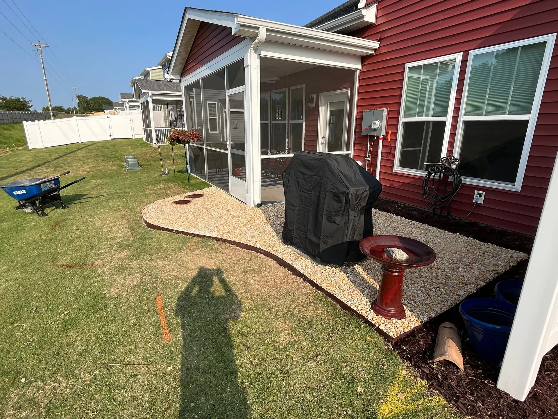 River rock grill pad screened porch red siding