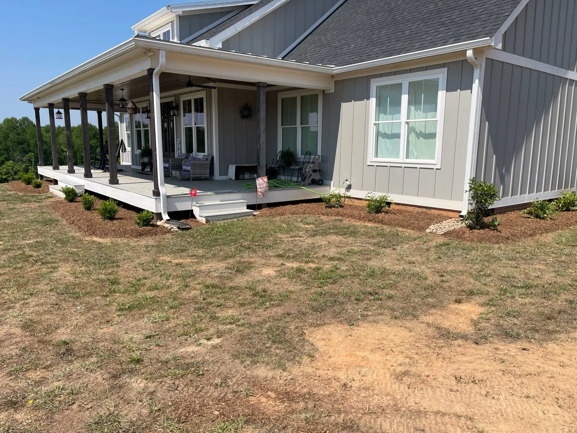 Wraparound porch foundation shrubs sparse lawn upstate SC